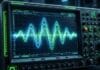 sound wave frequency visualization glowing blue oscilloscope music