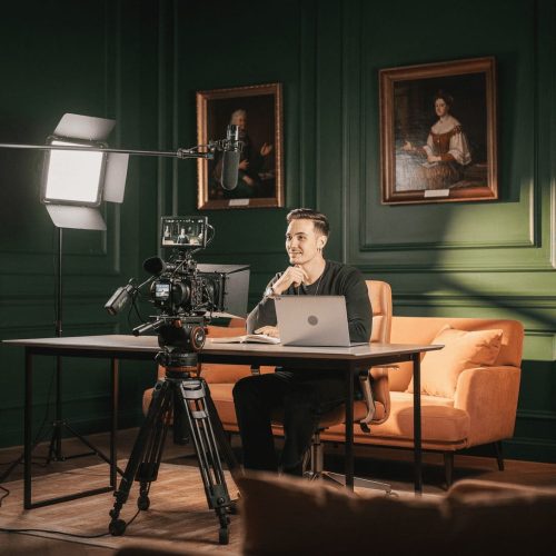 content creator filming video with professional camera equipment